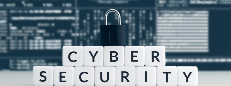 Cyber security words on blocks, closed padlock and computer data Cyber security words on cube blocks, closed padlock and computer data screen at background