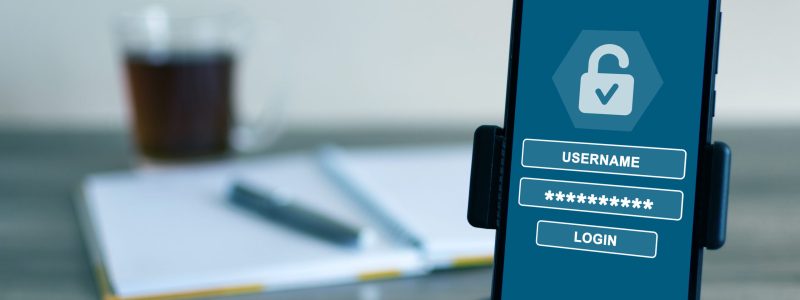 Username and password for login on the screen of a cell phone – cybersecurity concept A username and password for login on the screen of a cell phone - cybersecurity concept